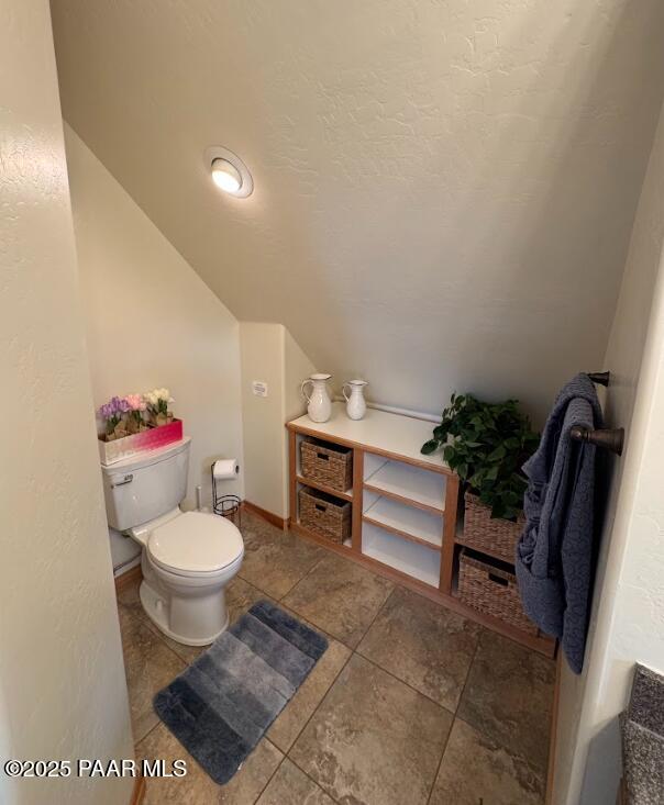 1740 West Bumblebee Road Chino Valley, AZ 86323 - Photo 15 of 44 a living room with furniture a rug and a toilet