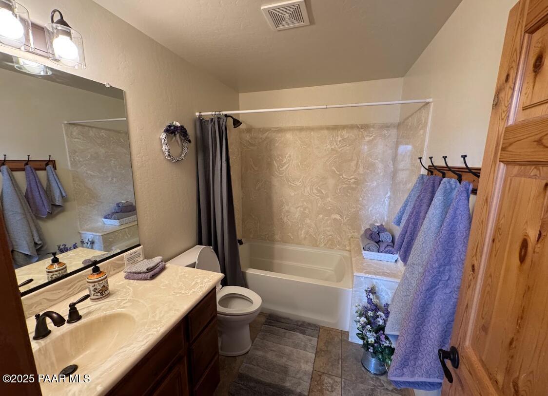 1740 West Bumblebee Road Chino Valley, AZ 86323 - Photo 19 of 44 a bathroom with a sink toilet and shower