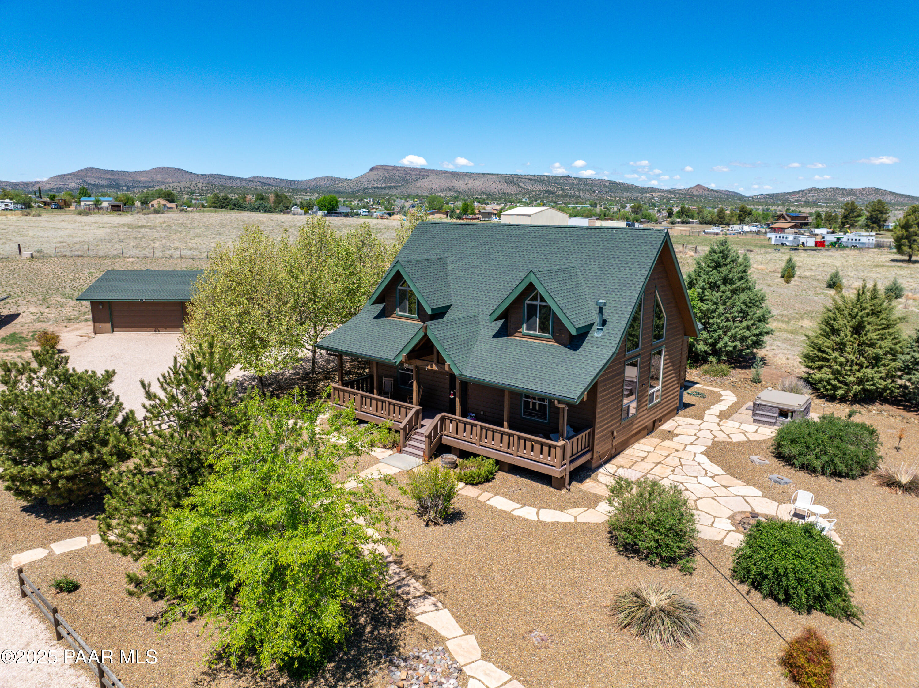 1740 West Bumblebee Road Chino Valley, AZ 86323 - Photo 32 of 44 an aerial view of a house with a garden and lake view