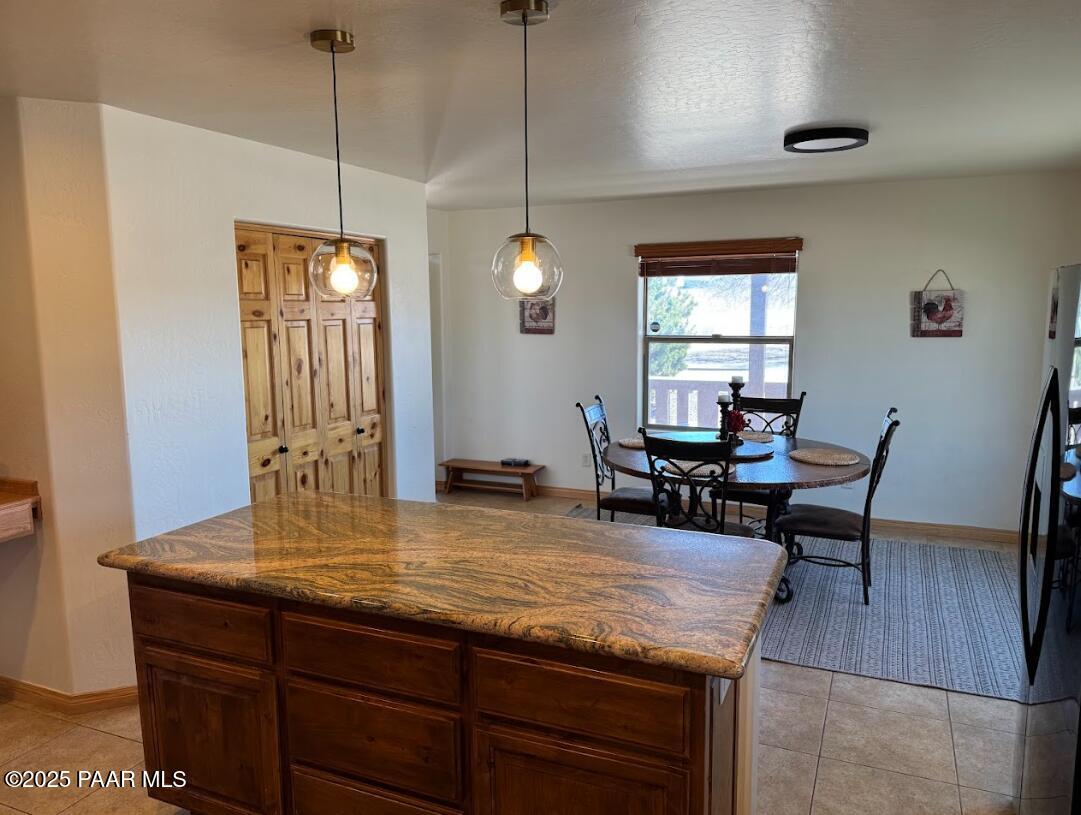 1740 West Bumblebee Road Chino Valley, AZ 86323 - Photo 6 of 44 a view of a dining room and livingroom with furniture wooden floor a rug and a chandelier