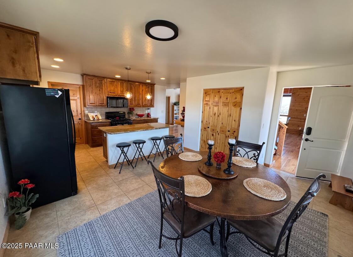 1740 West Bumblebee Road Chino Valley, AZ 86323 - Photo 7 of 44 a dining room with furniture and wooden floor
