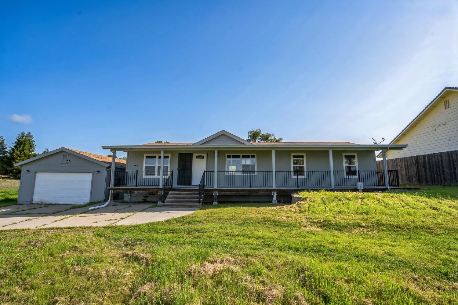 3477 Quail Hill Road Copperopolis, CA 95228 - Photo 1 of 1 a front view of a house with a yard