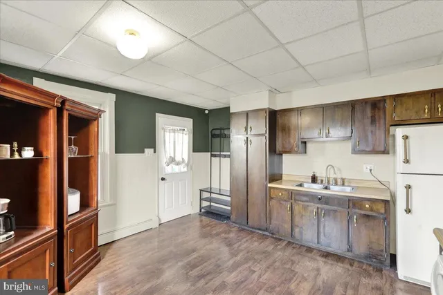 a kitchen with stainless steel appliances a refrigerator and a sink