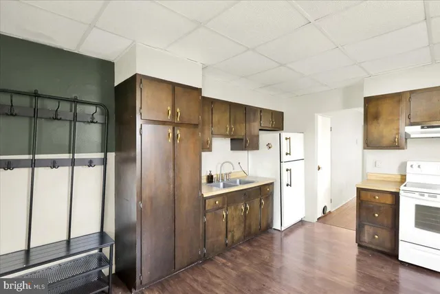 a kitchen with stainless steel appliances a refrigerator and a stove