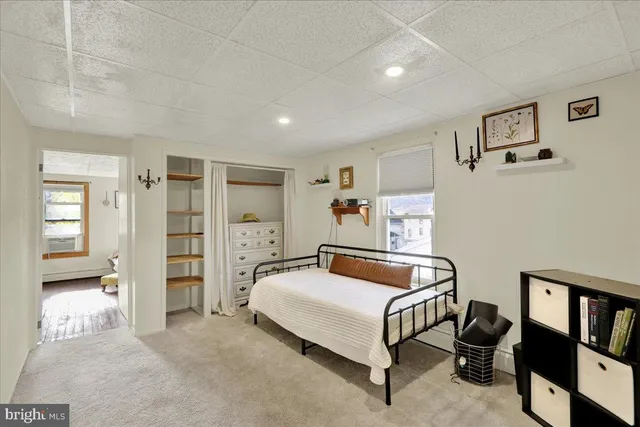 a bedroom with a bed and cabinets