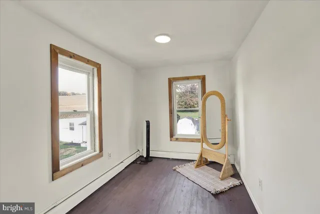 a room with painting and a table