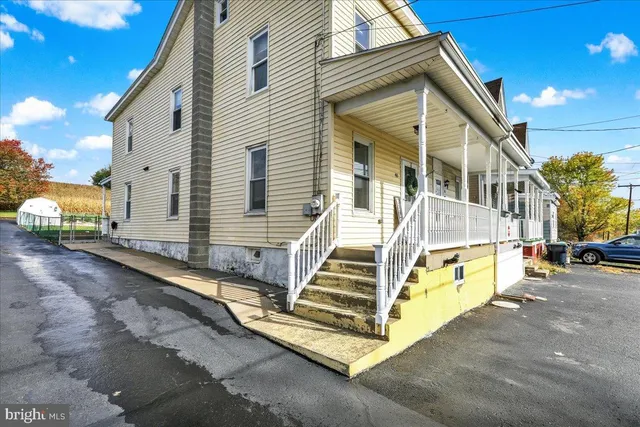 a view of a house with large windows