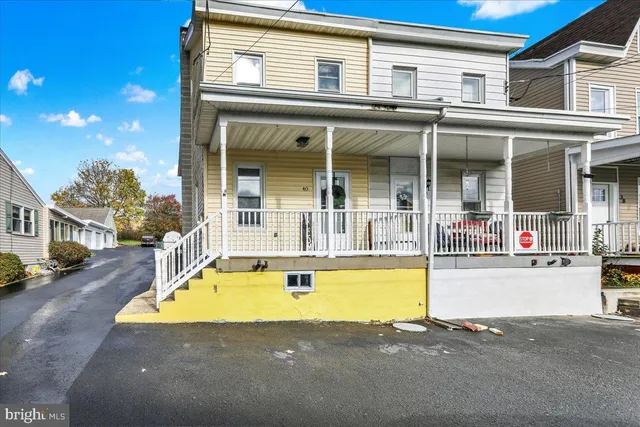 front view of a house with a swimming pool
