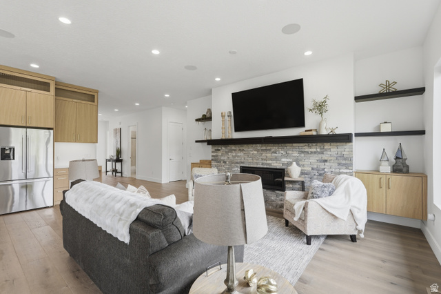 653 East Vandalay Lane Draper, UT 84020 - Photo 9 of 61 Spacious living area featuring light wood-finish flooring, recessed lighting, and built-in ceiling speakers