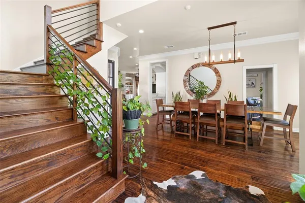 a view of entryway and hall with wooden floor