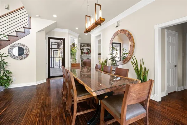 a view of a hallway view with wooden floor and staircase