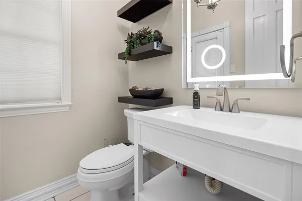 a bathroom with a toilet and a sink