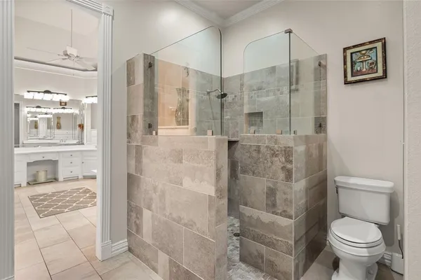 a bathroom with a shower and a toilet