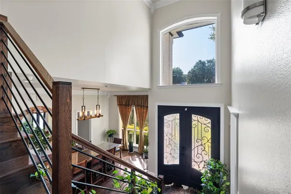 a front view of a house with balcony and furniture