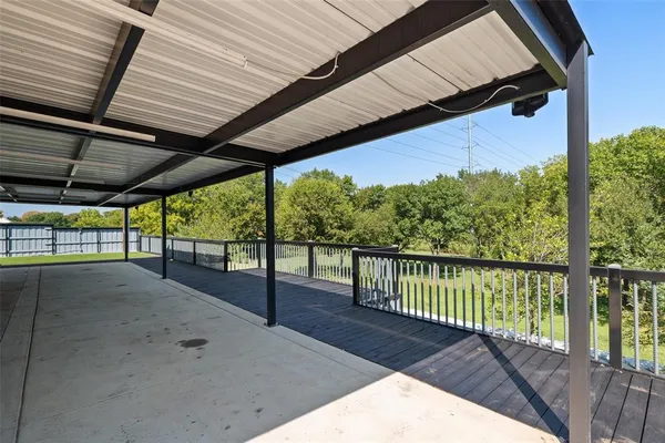 a view of balcony with wooden floor