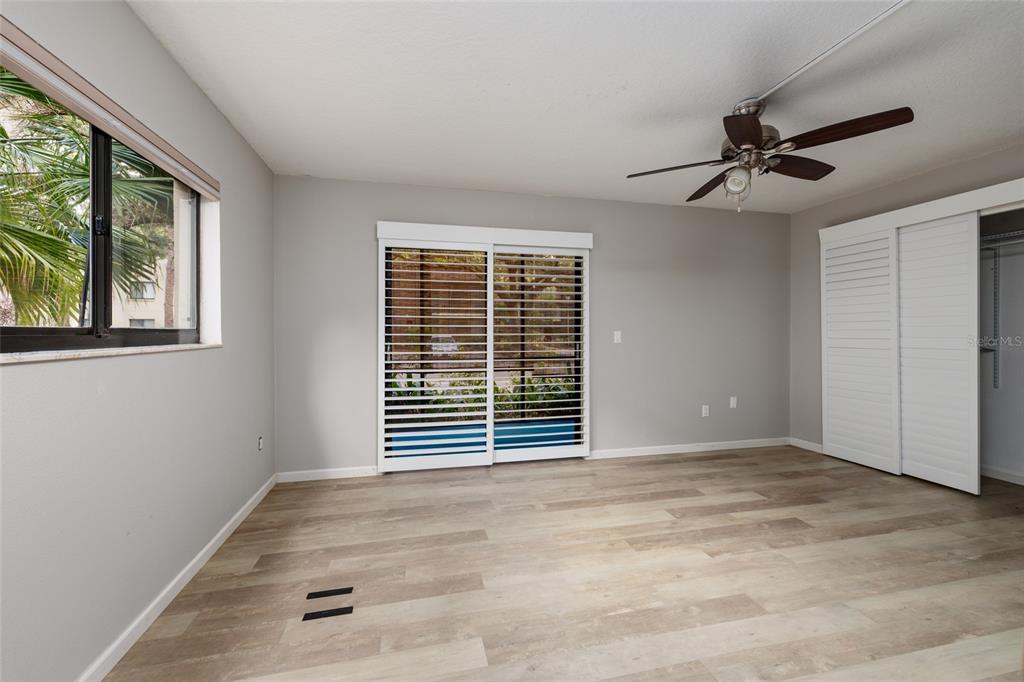 11708 Raintree Village Boulevard, Unit A Temple Terrace, FL 33617 - Photo 11 of 21 an empty room with windows and fan