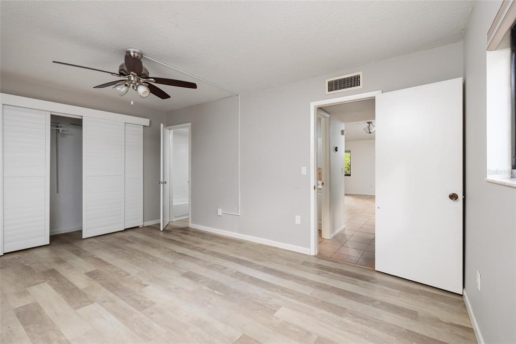 11708 Raintree Village Boulevard, Unit A Temple Terrace, FL 33617 - Photo 13 of 21 a view of empty room with wooden floor
