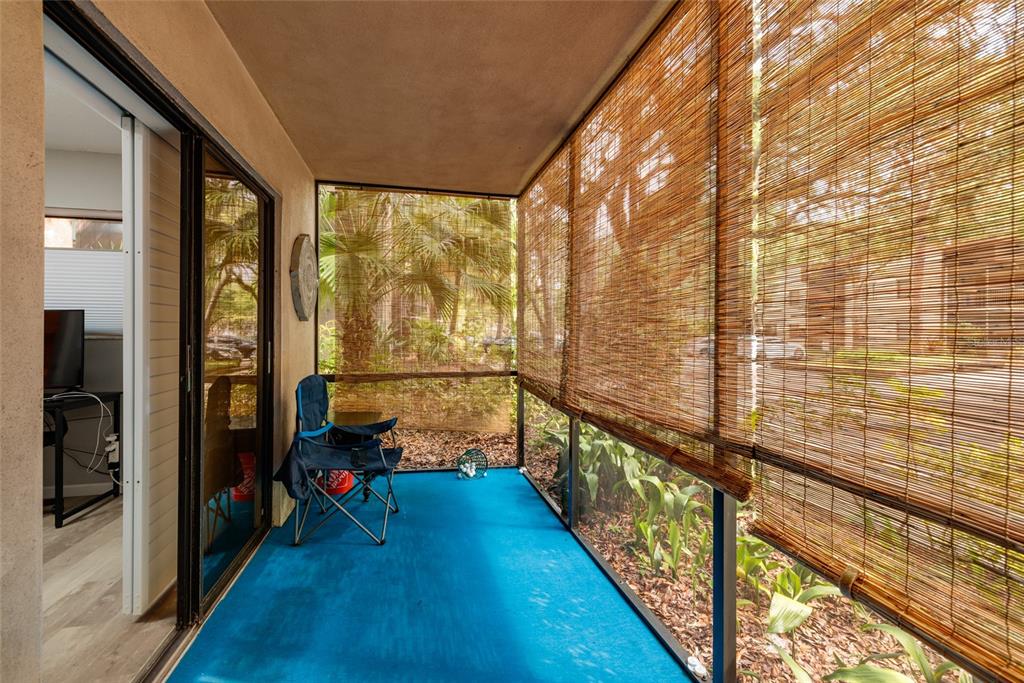 11708 Raintree Village Boulevard, Unit A Temple Terrace, FL 33617 - Photo 15 of 21 a room with city view and wooden floor