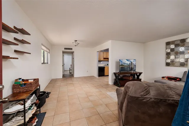 a view of a livingroom with furniture and a flat screen tv