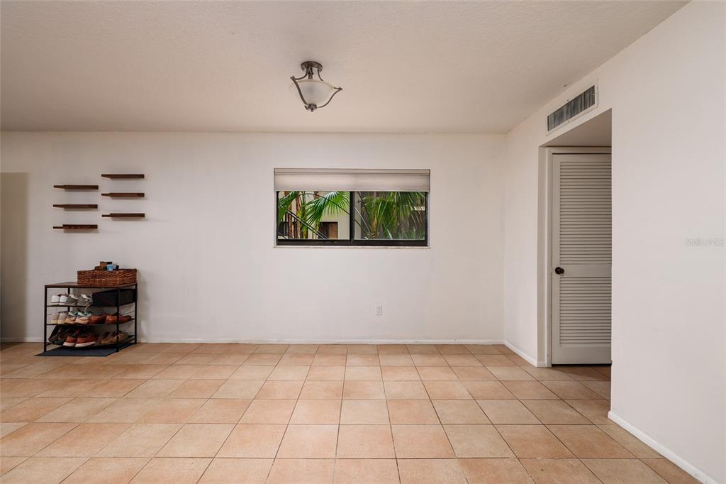 11708 Raintree Village Boulevard, Unit A Temple Terrace, FL 33617 - Photo 7 of 21 a view of room with hardwood