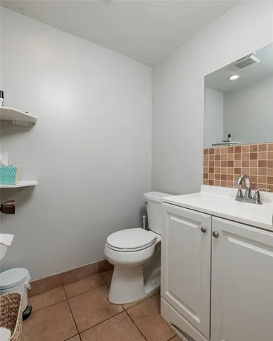 a bathroom with a toilet and a sink