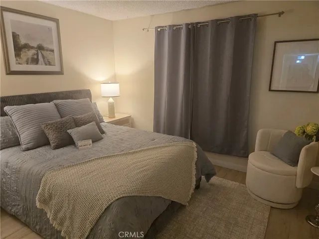 a bedroom with a bed and a couch