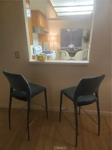a view of a dining room with furniture and window