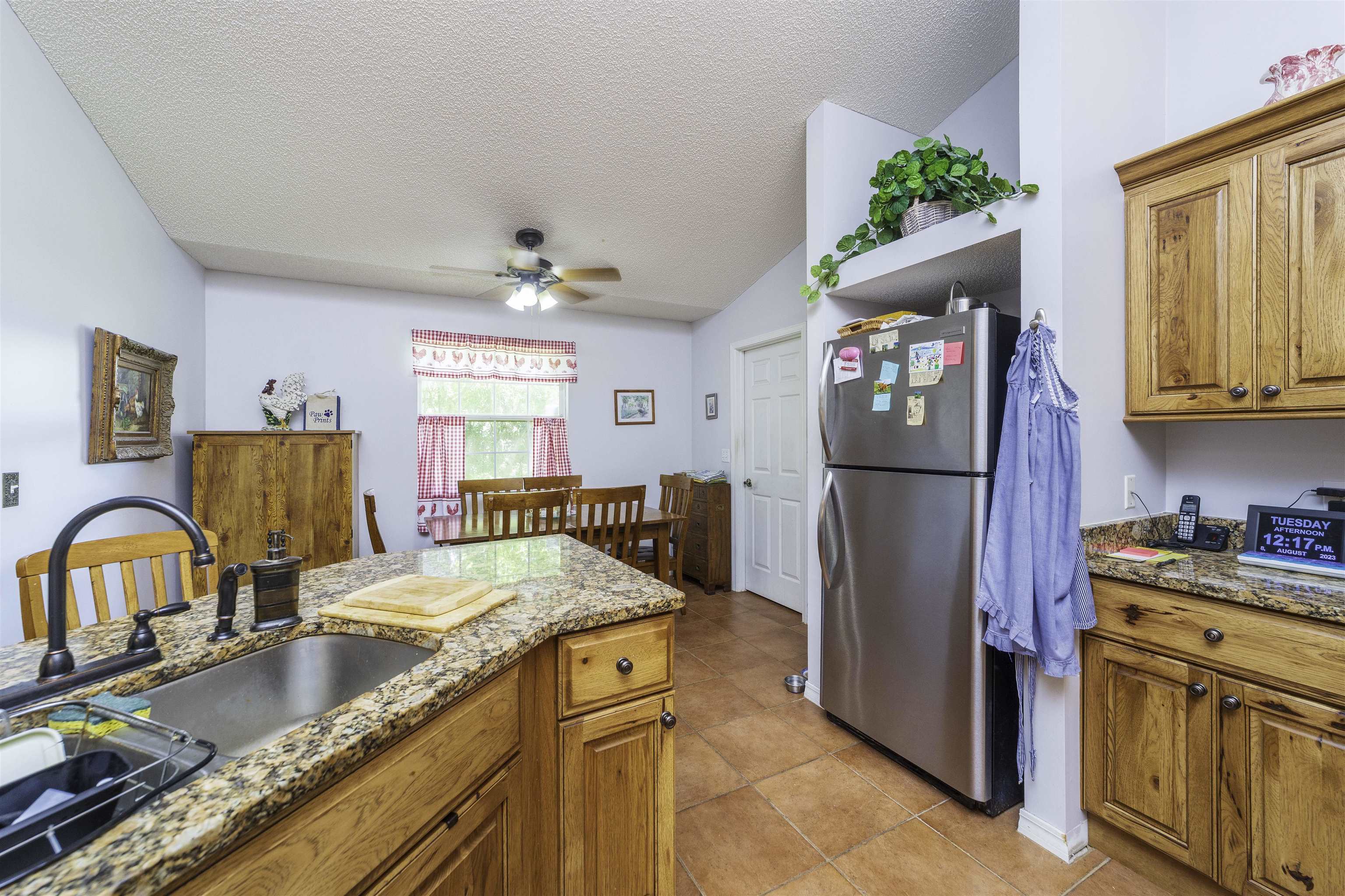 611 Royal Road St. Augustine, FL 32086 - Photo 11 of 59 a kitchen with granite countertop a refrigerator and a stove top oven