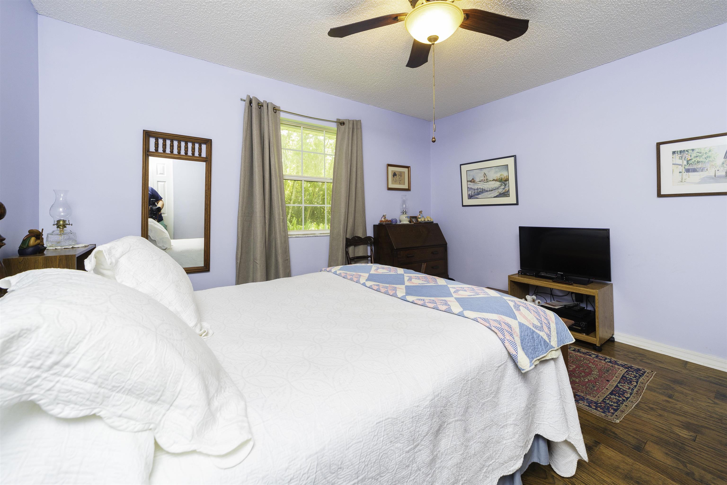611 Royal Road St. Augustine, FL 32086 - Photo 20 of 59 a bedroom with a bed and a flat screen tv