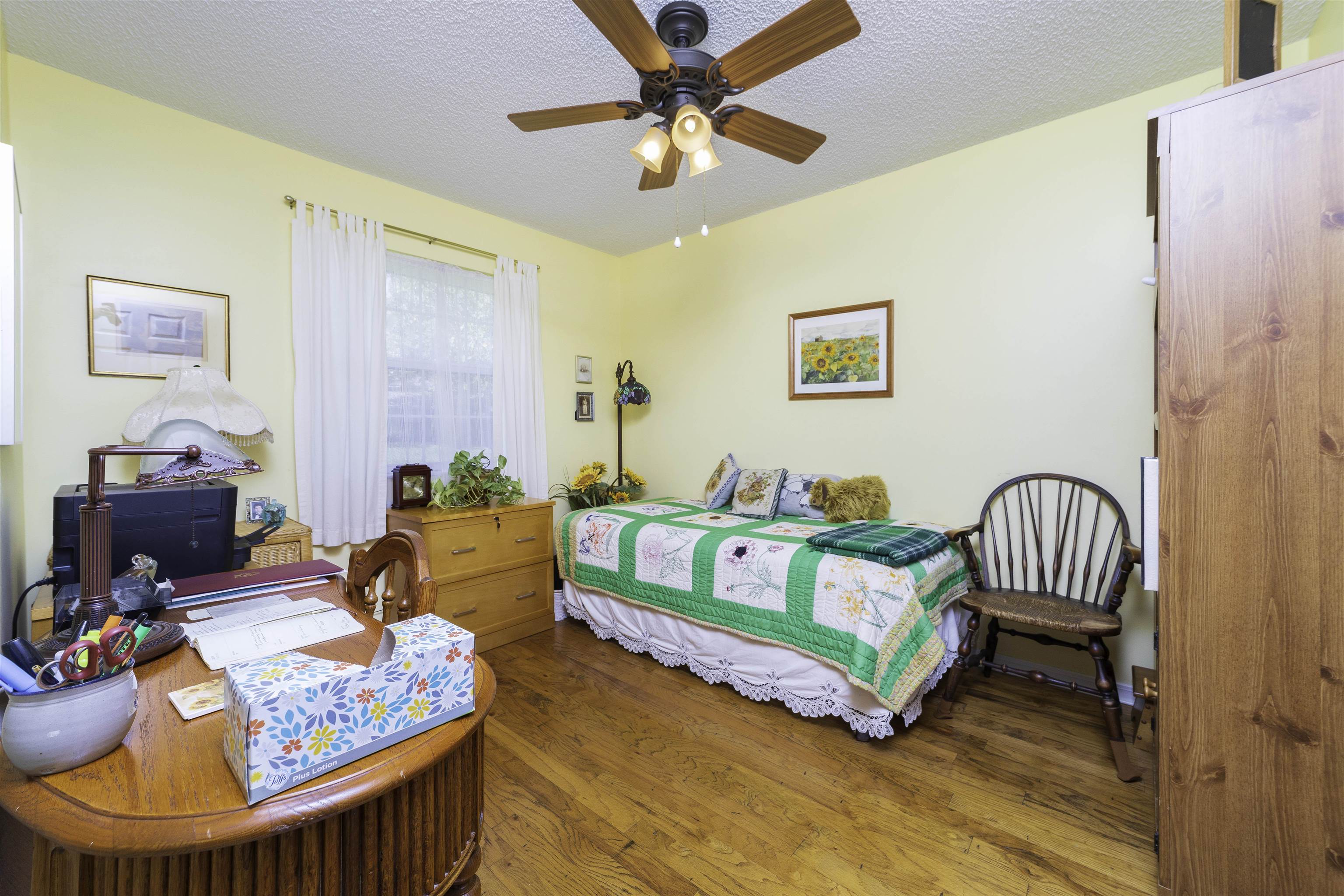 611 Royal Road St. Augustine, FL 32086 - Photo 23 of 59 a bedroom with a bed and a wooden floor