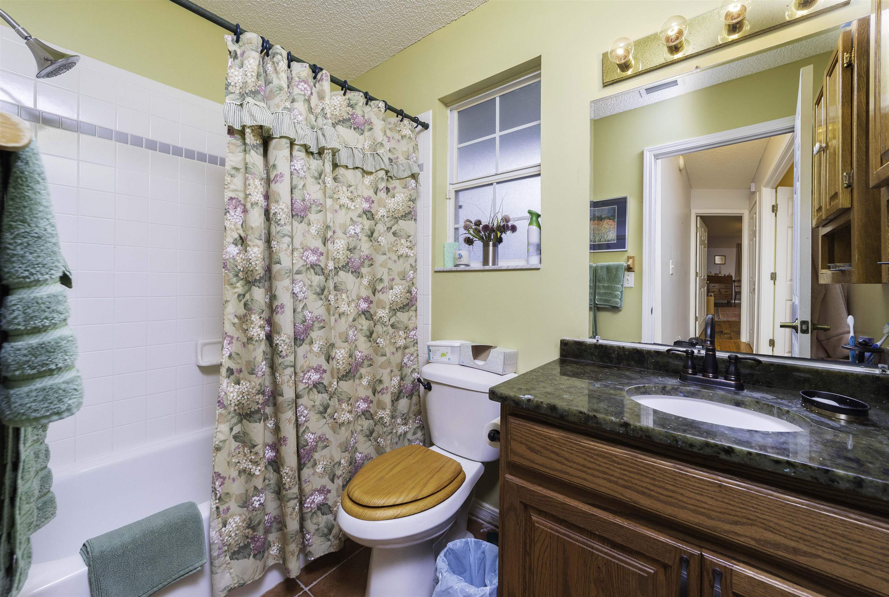 611 Royal Road St. Augustine, FL 32086 - Photo 26 of 59 a bathroom with a granite countertop sink toilet and shower