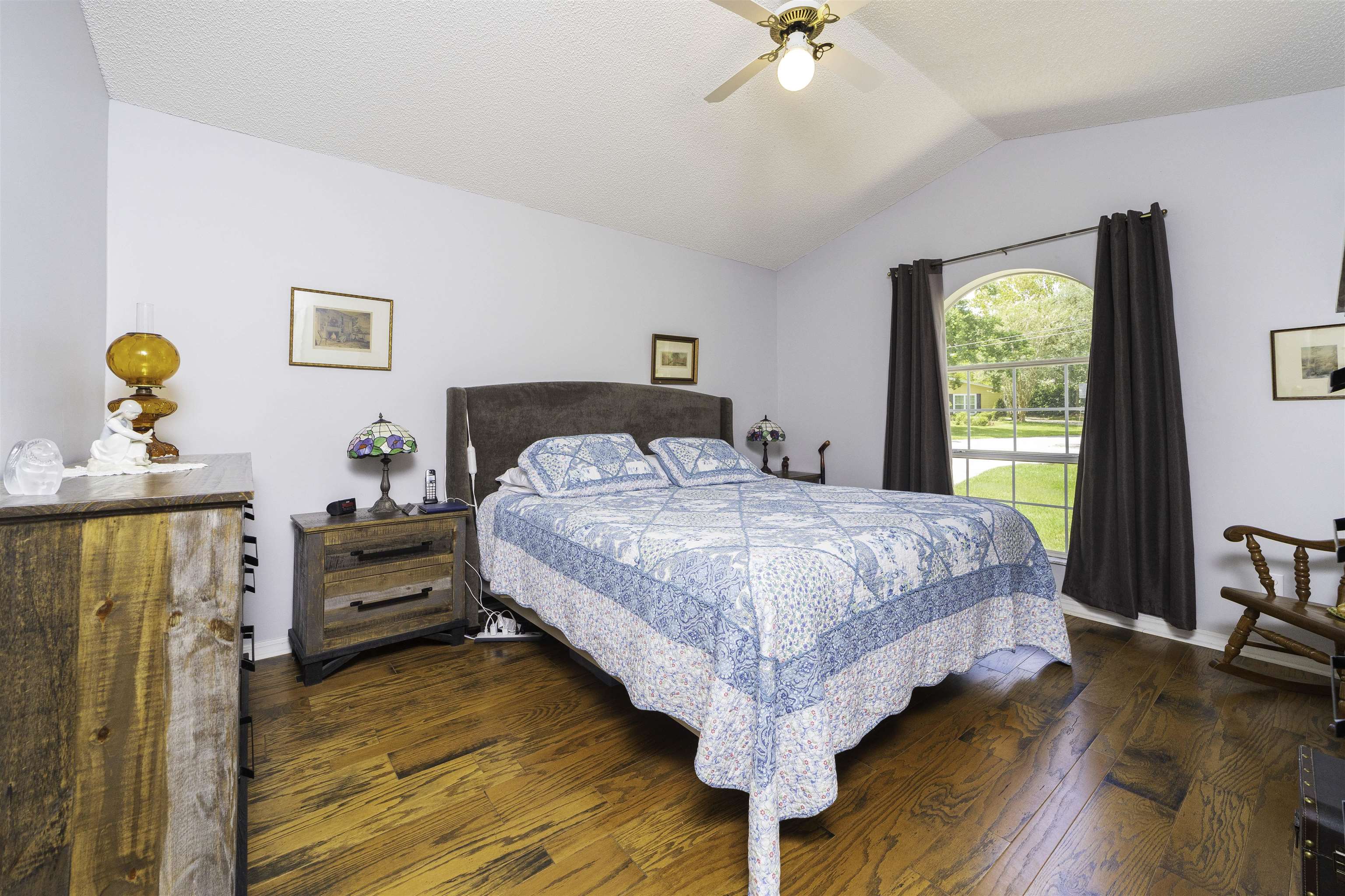 611 Royal Road St. Augustine, FL 32086 - Photo 27 of 59 a bedroom with a bed and a chandelier
