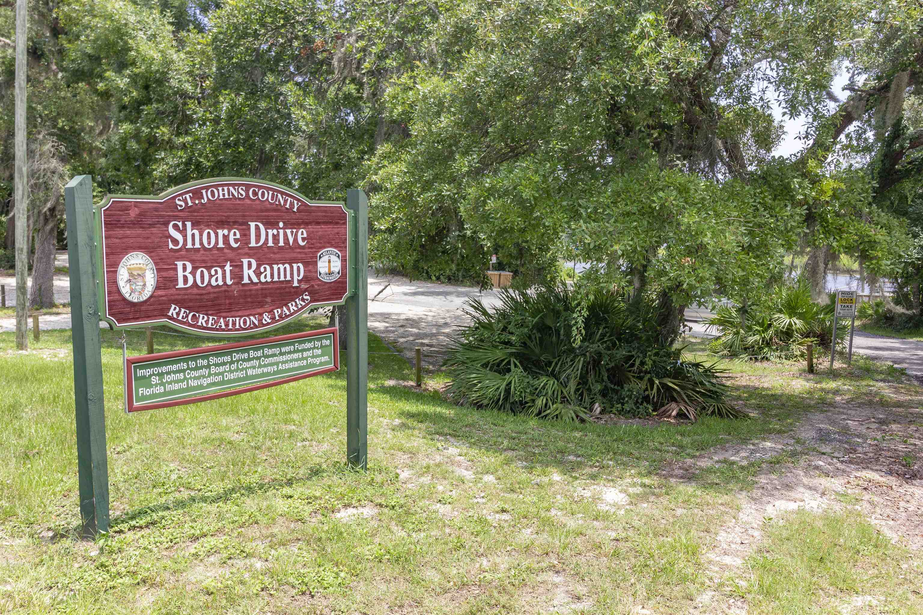 611 Royal Road St. Augustine, FL 32086 - Photo 48 of 59 a sign that is sitting on a brick wall