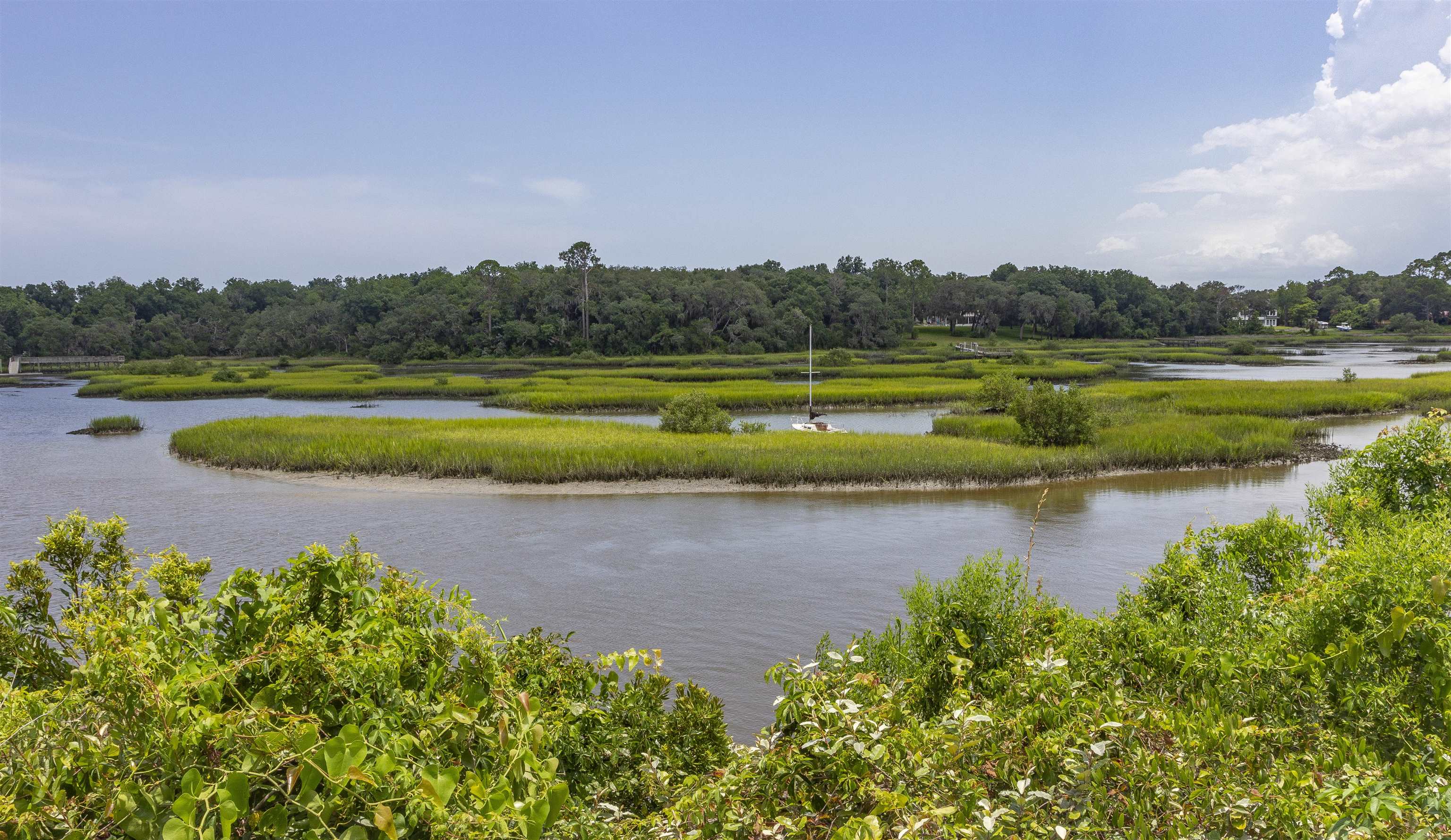 611 Royal Road St. Augustine, FL 32086 - Photo 53 of 59 a view of a lake with houses in the back