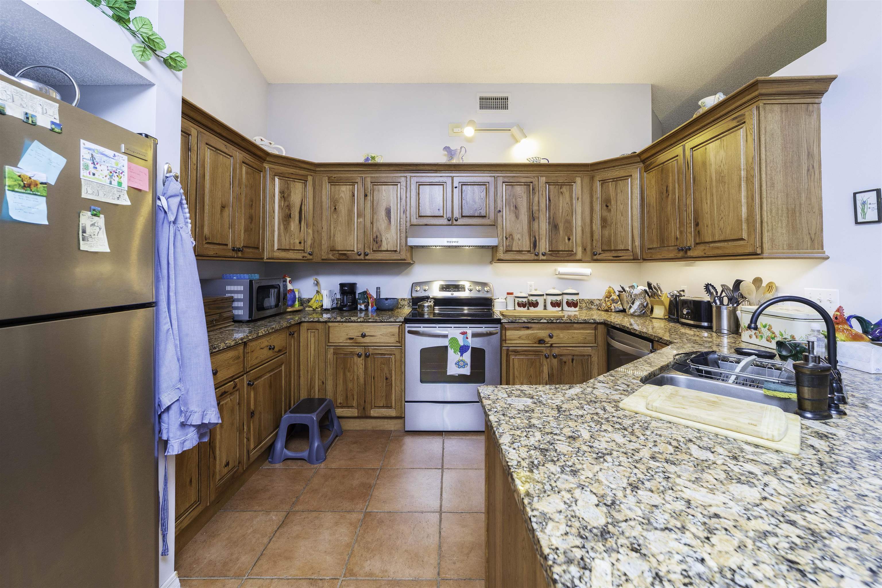 611 Royal Road St. Augustine, FL 32086 - Photo 8 of 59 a kitchen with stainless steel appliances granite countertop a stove a sink dishwasher and a refrigerator