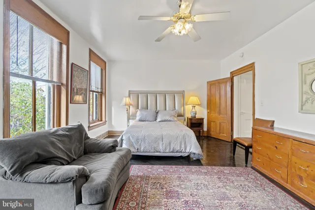 a bedroom with furniture and a dresser