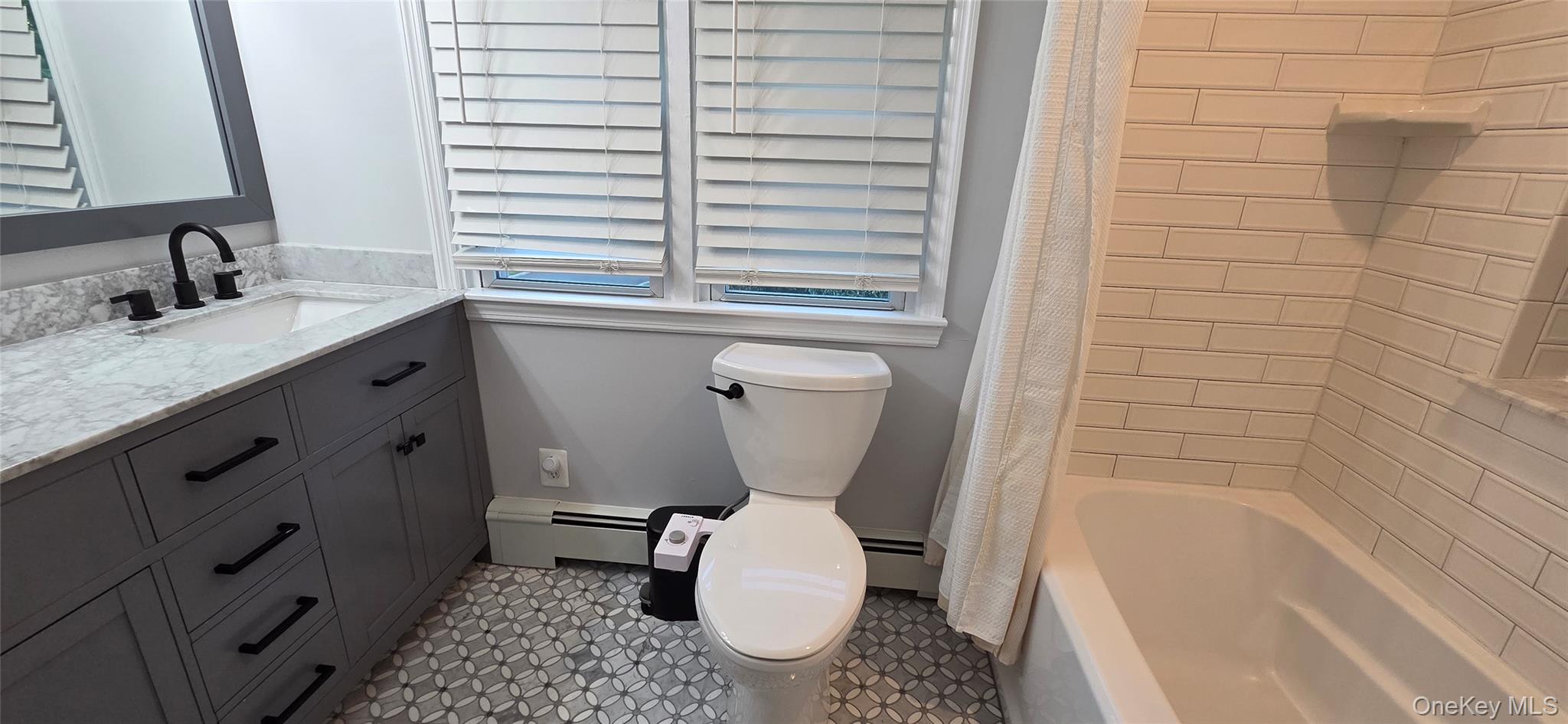 522 Moriches Road St. James, NY 11780 - Photo 35 of 49 a bathroom with a granite countertop toilet sink and mirror