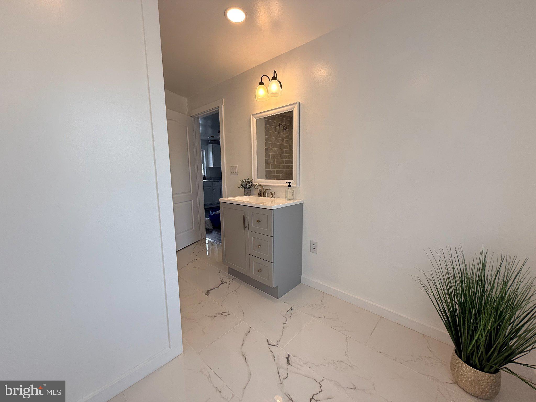 385 Herr Street Lock Haven, PA 17745 - Photo 17 of 25 Sleek modern bathroom with elegant finishes.