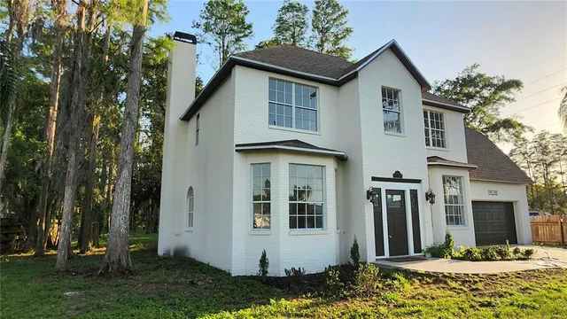 a view of a house with a yard