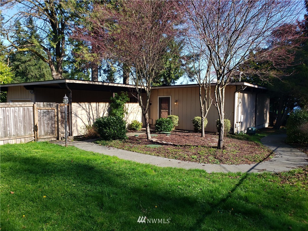 8690 Illahee Road Northeast Bremerton, WA 98311 - Photo 1 of 40 a view of a backyard with a tree