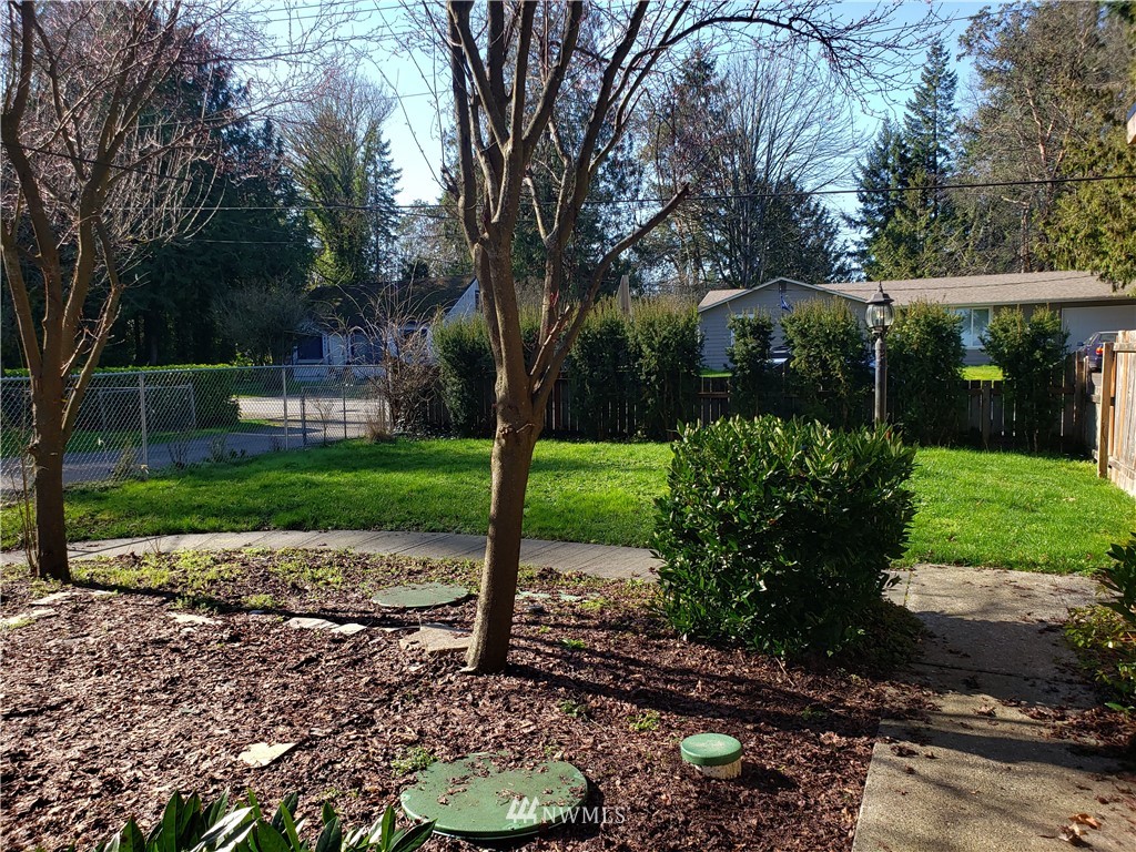 8690 Illahee Road Northeast Bremerton, WA 98311 - Photo 2 of 40 a view of a backyard with a garden