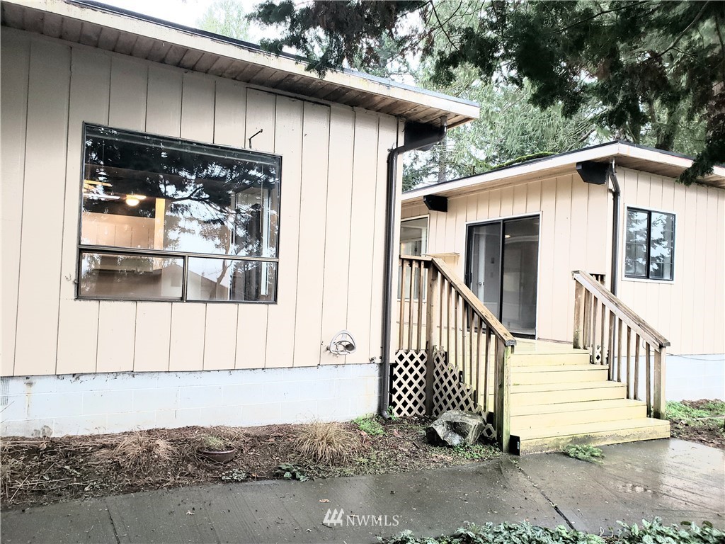 8690 Illahee Road Northeast Bremerton, WA 98311 - Photo 11 of 40 a front view of a house with a yard