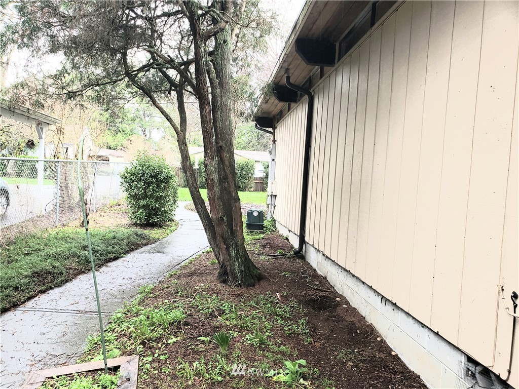 8690 Illahee Road Northeast Bremerton, WA 98311 - Photo 21 of 40 a view of a porch with a tree