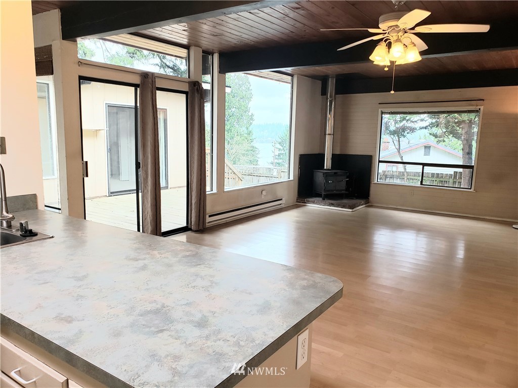 8690 Illahee Road Northeast Bremerton, WA 98311 - Photo 22 of 40 a view of a livingroom with furniture and chandelier fan