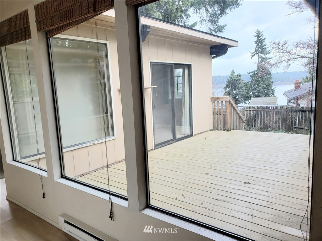 8690 Illahee Road Northeast Bremerton, WA 98311 - Photo 29 of 40 a view of a balcony with wooden floor