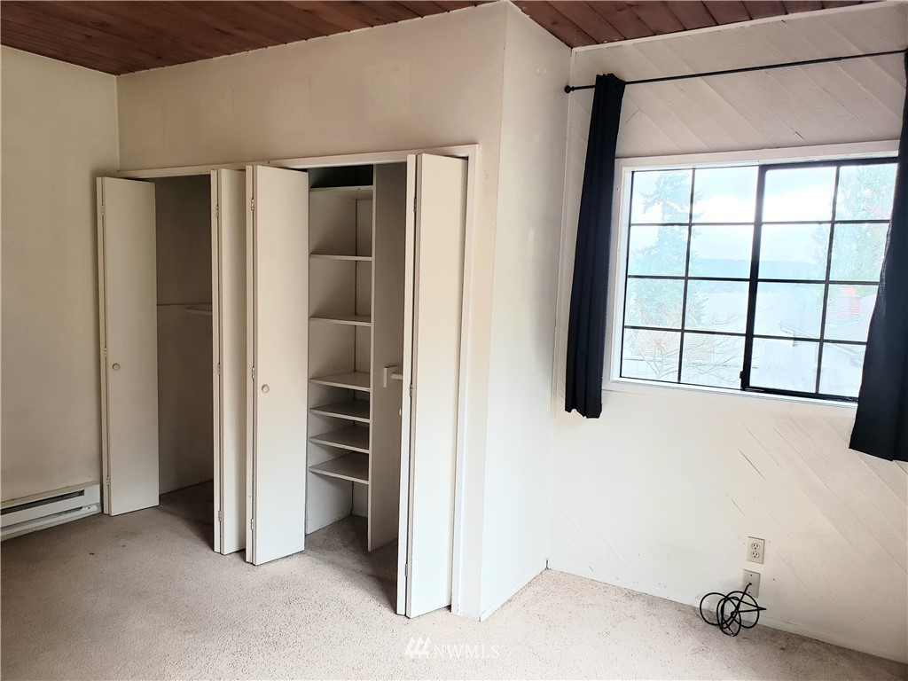 8690 Illahee Road Northeast Bremerton, WA 98311 - Photo 33 of 40 a view of an empty room with a window
