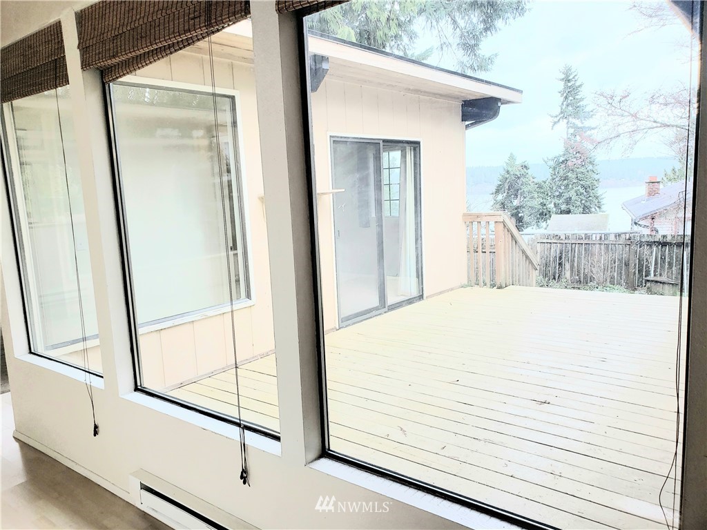 8690 Illahee Road Northeast Bremerton, WA 98311 - Photo 35 of 40 a view of a balcony with wooden floor