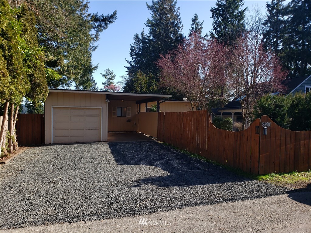 8690 Illahee Road Northeast Bremerton, WA 98311 - Photo 6 of 40 a front view of a house with a yard