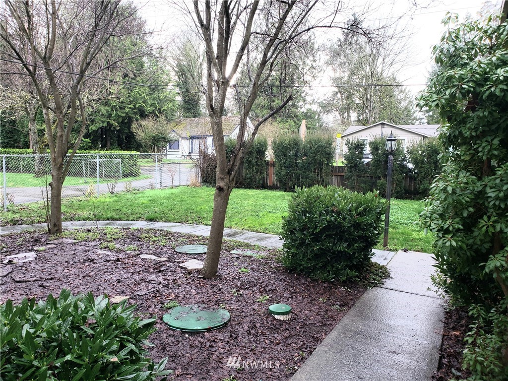 8690 Illahee Road Northeast Bremerton, WA 98311 - Photo 8 of 40 a view of a backyard with green space