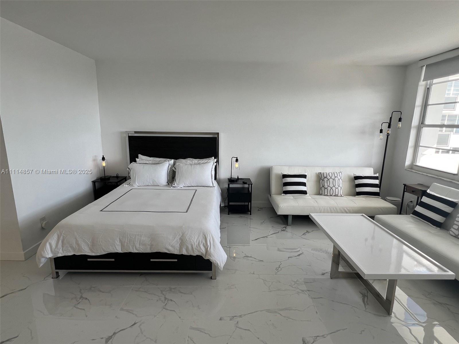 100 Lincoln Road, Unit 1207 Miami Beach, FL 33139 - Photo 15 of 54 a bedroom with bed and window